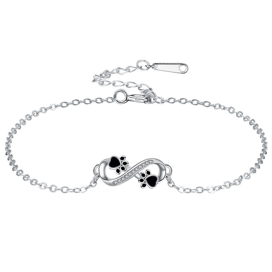 Bracciale con simbolo dell'infinito, charms con impronta di zampa e zirconi