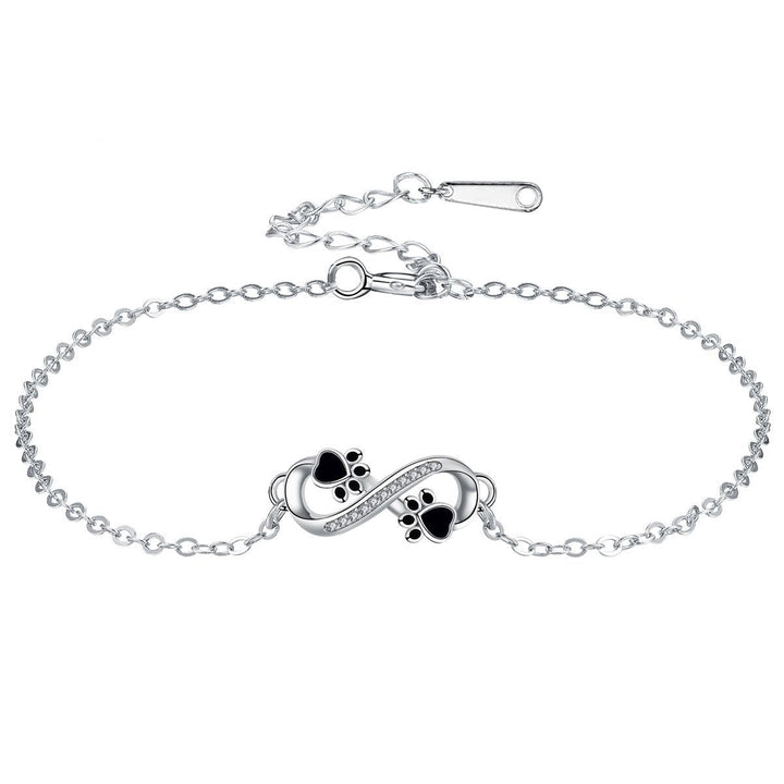 Bracciale con simbolo dell'infinito, charms con impronta di zampa e zirconi