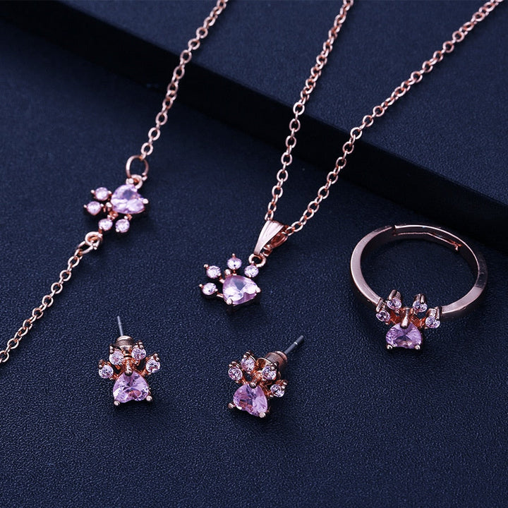 Set di Gioielli con Zampe per Donne – 4 Pezzi | Oro Rosa con Cuore di Zirconia – Anello, Collana, Orecchini e Braccialetto